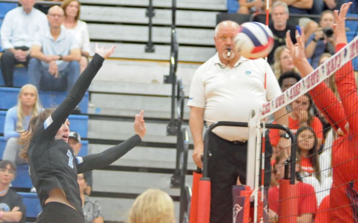 Hagerty's Brooke Stephens tries to get a kill off Lake Brantley's block. Stephens had a match-high 27 kills in the Huskies' Region 1-7A final victory.